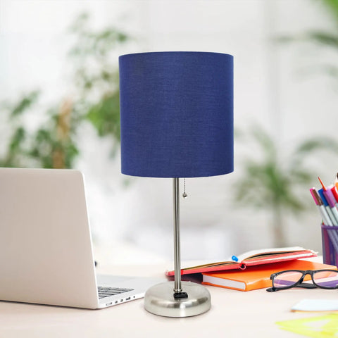 Brushed Steel Desk Lamp With Built In Charging Outlet And Drum Fabric Shade on an office desk with laptop and books