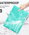 Hand holding a Teal Bubble Mailers 6x10 Inch Inner 6x9 Inch 25 Pack Padded Envelopes With Self Seal Waterproof Opaque Shipping Bags