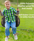 Child sitting on Heavy Duty Swing Seat For Adults And Kids With Weatherproof Ropes, Height Adjustable Tree Swing Accessory, Black.