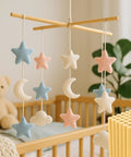 Pack Of Twenty Round Quarter Inch Bamboo Dowel Rods Forty Eight Inches Long Smooth As Silk Premium Natural Craft Sticks For Diy Models Floral Decor And School Assignments A Sweet Makers Stash hanging mobile with felt stars, moons, and clouds in pastel colors.