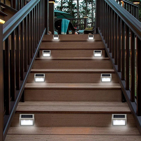 Outdoor Solar Deck Lights Pack Of 6, Waterproof Stainless Steel Stair And Path LED Lights illuminating wooden stairs