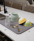 Top Shelf Microfiber Dish Drying Mat Extra Large 18 X 24 Inch Countertop Pad with dishes and utensils on kitchen counter.