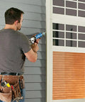 Person applying P625 Crack Flex Sealant White 12 Pack DIY Friendly Polyurethane Construction Sealant to window frame.