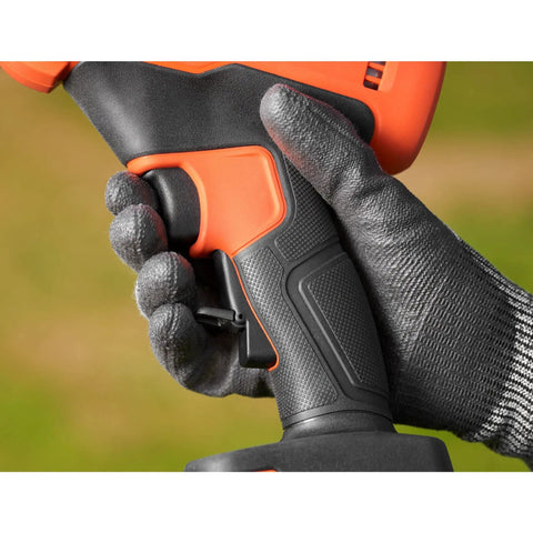 Close-up of hand gripping the trigger of the Premium 18V Cordless Hand Grass Trimmer With 2Ah Lithium Battery for ergonomic use.