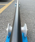 Beefy Heavy Duty Cable Puller Sheave for Large Scale Laying showing pipeline sliding over aluminum U-groove base on pavement