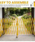 Worksite Tough Heavy Duty Steel Traffic Barricade With Smooth Glide Wheels And No Fuss Scissor Safety Gate in yellow, easily installed, outdoors.