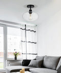 Semi Flush Mount Ceiling Light With Clear Glass Shade Modern Vintage Vibe Fixture in living room with grey sofa