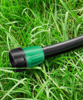 Close-up of a green and black garden hose connector for Eight Pack Three Quarters Inch To One Half Inch Faucet Adapters For Drip Irrigation.