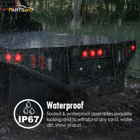 Rear view of truck in rain with 4 Pack 2 Inch Round Led Side Marker Clearance Lights With Grommets And Wire Pigtails For Trailers And Trucks DOT Approved 12V Submersible Waterproof Reflex Lens Red And Amber 2 Red 2 Amber