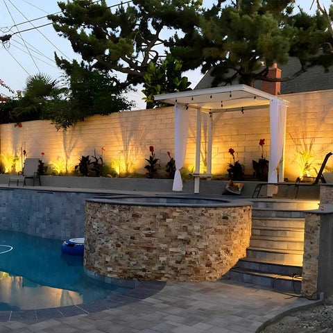 Outdoor Uplight Landscape Spotlight Kit With Transformer, 6 Pack Low Voltage Garden Lights illuminating a backyard patio area