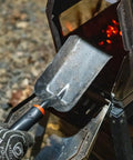 Heavy Duty Ash Shovel For Fire Pits And Grills, Manganese Steel Ember Remover 12.6 Inch Wood Stove Scoop in use near charcoal