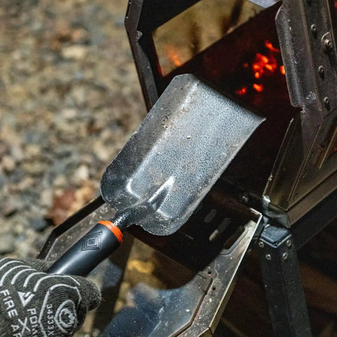 Heavy Duty Ash Shovel For Fire Pits And Grills, Manganese Steel Ember Remover 12.6 Inch Wood Stove Scoop in use near charcoal