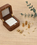 8mm Hidden Brass Barrel Hinges Set For DIY Jewelry Boxes And Small Wooden Boxes, 180 Degree Concealed Cabinet Hinges In Solid Brass With Rust Resistant Gold Tone Finish, Includes 4 Hinges displayed next to an open wooden jewelry box.
