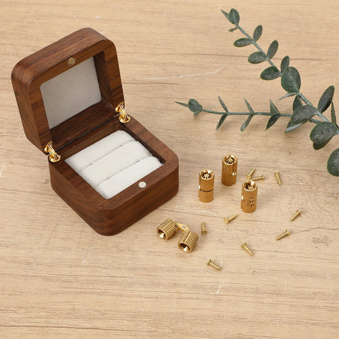 8mm Hidden Brass Barrel Hinges Set For DIY Jewelry Boxes And Small Wooden Boxes, 180 Degree Concealed Cabinet Hinges In Solid Brass With Rust Resistant Gold Tone Finish, Includes 4 Hinges displayed next to an open wooden jewelry box.