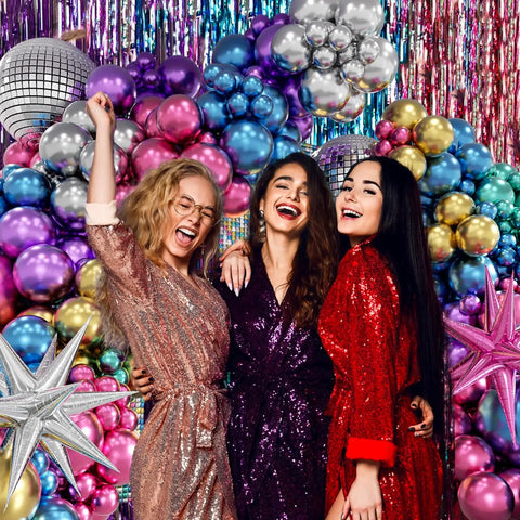 Three people in front of a 135 Piece Disco Balloon Arch Kit With Silver Blue Green Purple Hot Pink And Gold Metallic Balloons And Star Foil Balloons.