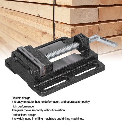 Mini Bench Vise 6.1 By 5.5 Inch Cast Iron Drill Press Vise With 180 Degree Rotatable Workbench Clamp and Stable Jaw beside wood stacks