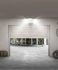 LED Hardwired Emergency Light Kit With Dual Adjustable Heads Backup Battery 6 Pack White in a garage setting
