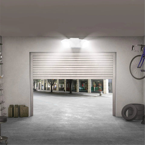 LED Hardwired Emergency Light Kit With Dual Adjustable Heads Backup Battery 6 Pack White in a garage setting