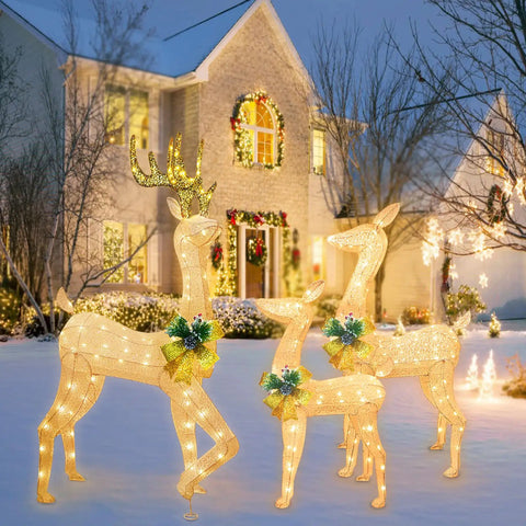 Lighted Outdoor Reindeer Family Set For Christmas 3 Piece Yard Decor With 230 Warm White LEDs in front of house at dusk