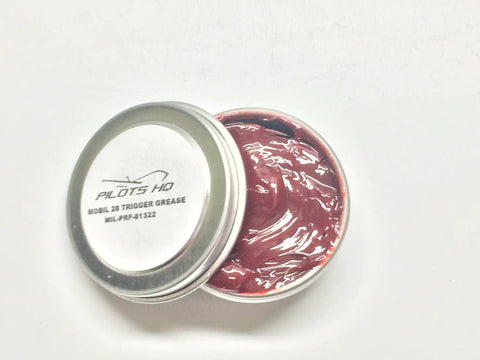 Open container of Quarter Ounce Gun Grease Kit For Triggers And Small Firearms Built For Gear Heads Mil Spec Lubricant Trusted By Trigger Manufacturers Mil G 21164D Compliant Mil Prf 81322G DOD G 2450, showing red grease