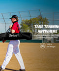 Person carrying a 12x9 Foot Barricade Backstop Net For Baseball Softball Lacrosse Soccer Basketball And More Durable 5 Ply Knotless Netting Black Practice Barrier Net with portable bag on a field