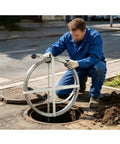Top Tier Heavy Duty Manganese Steel Sewer Drain Snake With 49 Foot Auger Cable being used for clog removal in a drain.