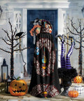 Person wearing the Halloween Adult Hooded Cape With Full Body Transfer Print For Costume Role Play Masquerade Theme Party And Carnival, Vibrant Prints, against a decorated porch with pumpkins and lanterns.