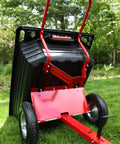 Rock Solid Six Hundred Fifty Pound Poly Dump Cart showing black bin, red frame, and pneumatic tire, ideal for yard debris hauling.