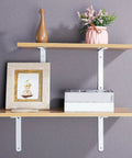 Solid As A Rock Heavy Duty Wall Mounted Shelf Brackets For Clean Floating Planks With Gritty Industrial Look And No Sweat Setup For Impressive Home Organization Hacks Set Of Two Bright White, featuring wooden shelves with decor.