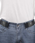 Person wearing No Buckle Elastic Belt For Men, Stretch Buckle Free Jeans Belt, 1.38 Inch Wide, Black on blue jeans