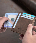 Person holding Ultra Slim Front Pocket Leather Wallet With RFID Blocking Minimalist Card Holder Only 0.12 Inch Thick Measures 3.1 X 4.4 Inches