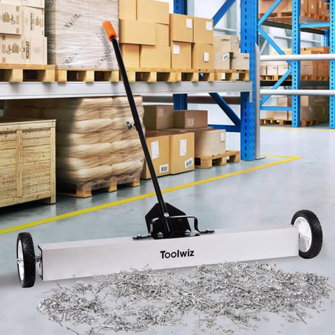 Heavy Duty 36 Inch Rolling Magnetic Sweeper With Quick Release Handle, metal debris on a warehouse floor, tool for cleaning nails and screws.