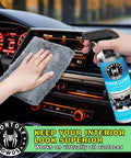 Complete All In One Car Wash And Detailing Kit with Interior Cleaner being used on car dashboard with gray microfiber towel