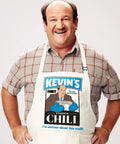 Man wearing The Office Inspired Kevin's Famous Chili Cook-Off Fan Favorite Apron With Pockets And Adjustable Neck Strap 100 Percent White Cotton