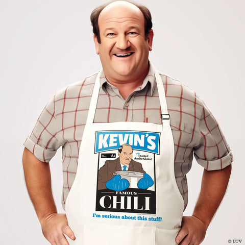 Man wearing The Office Inspired Kevin's Famous Chili Cook-Off Fan Favorite Apron With Pockets And Adjustable Neck Strap 100 Percent White Cotton