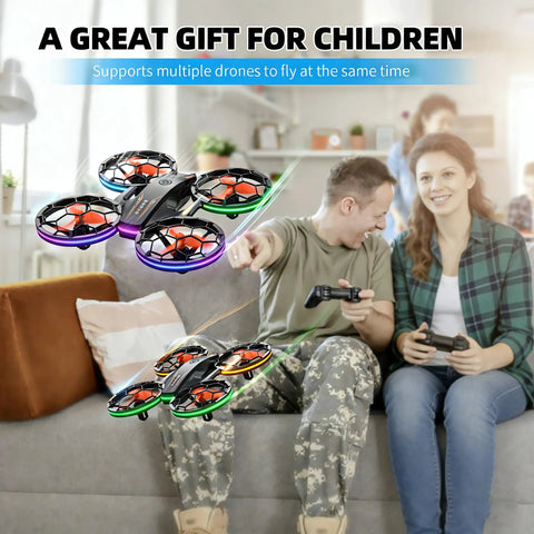 RC Drone With Auto Hover And Headless Mode For Easy Night Flights LED Lights Full Prop Guard shown in living room with people