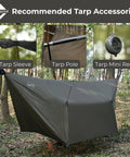 12 By 10 Ft Ultralight Camping Hammock Tarp Rainfly With Doors set up in forest with tarp sleeve, pole, and mini reel accessories