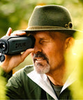Man using Scion OTM 9Hz Thermal Imaging Monocular With Onboard Video Recording And MicroSD Expansion outdoors