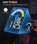 Gloved hand holding Auto Ranging Digital Multimeter With 10000 Counts TRMS Color LCD Screen in dimly lit environment
