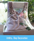 Decorative utility bag with clear panel and floral accents, featuring 25 Sets 1 Inch Grommets And Eyelets Kit With Washers.