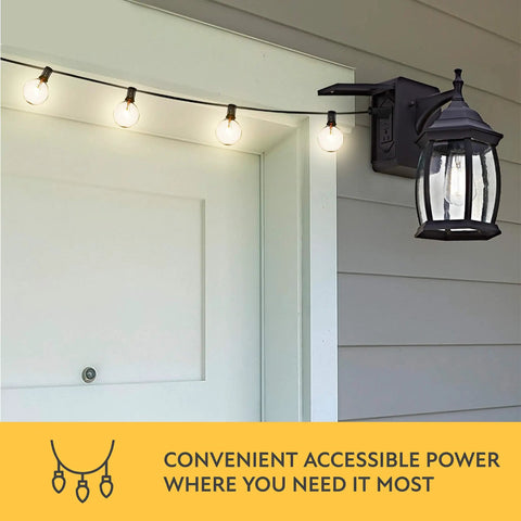 Traditional Outdoor Wall Sconce With Seeded Glass And Two Built In GFCI Outlets For Easy Access Power Black Finish Weather Resistant Porch Lighting For Patio Or Garden mounted on wall with string lights