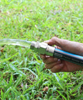 Person holding garden hose with Heavy Duty 3/4 Inch Garden Hose Repair Kit With Stainless Steel Male And Female Ends attached