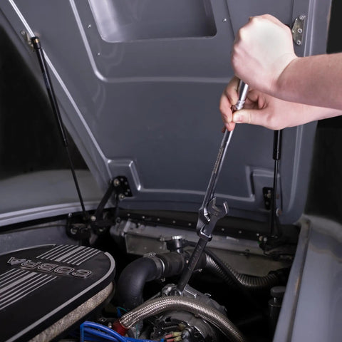 Torque Boost Wrench Extender Tool For Tight Spaces used to loosen bolt in engine compartment with extra leverage