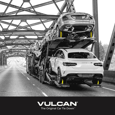 Car tied down using Heavy Duty Auto Hauler Car Tie Downs With Rolling Idler Three Cleat, 120 Inch Length, 4 Pack, on transport truck.