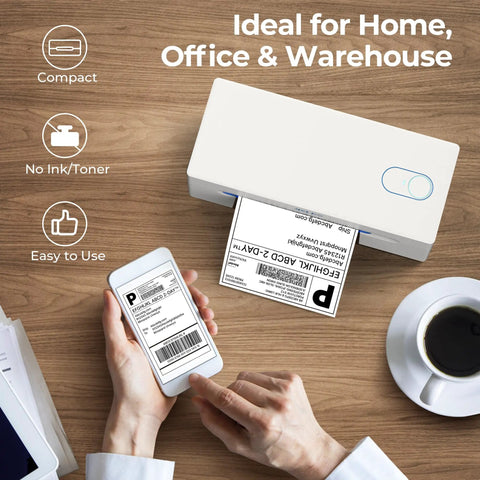 Bluetooth Thermal Shipping Label Printer For Small Biz Wireless 4x6 Label Printer That Works With IPhone Android Windows Great For Amazon eBay Shopify Etsy White on wooden desk with person holding phone and printed label.