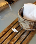 Sauna Steamer Connector Hose Joint Durable Plastic Replacement Fitting on wooden surface near spa bucket and flowing water