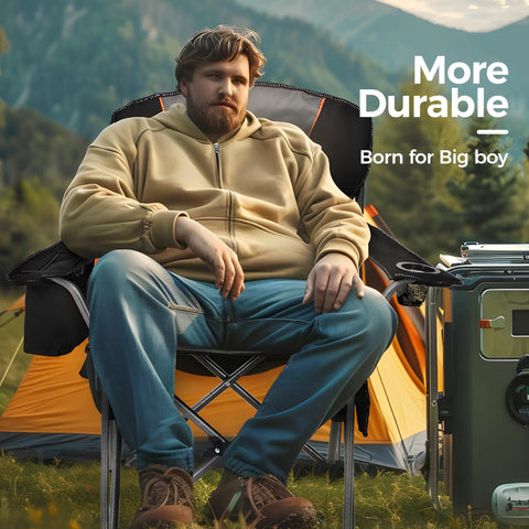 Man sitting in Heavy Duty Camping Chair With 500 Lbs Capacity, XXL Oversized, Fully Padded Portable Outdoor Seat, black