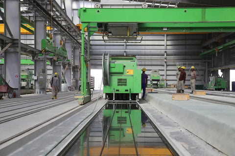 Industrial site with machinery and workers, showcasing lockout tagout compliance for safety and energy control.