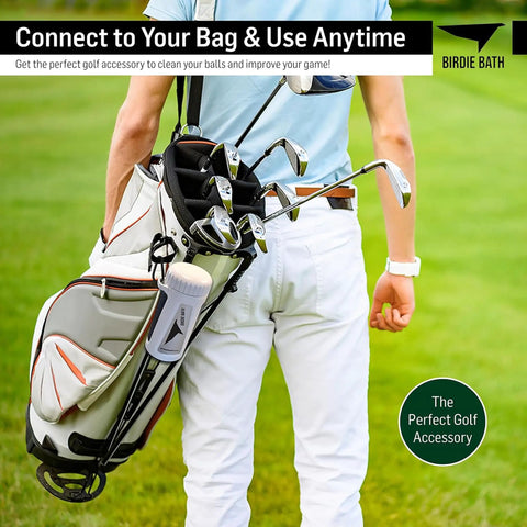 Portable Golf Ball Cleaner For On Course Use Personal Ball Washer attached to golf bag on grass