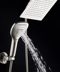Ultra Luxury 9 Inch Rainfall Shower Head And Handheld Combo with satin nickel finish and push button flow control in operation.